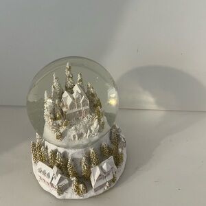 White and gold snow globe with a winter cottage scene #winterwonderland